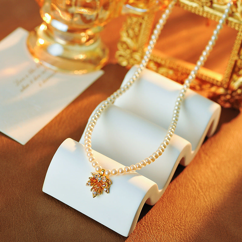2025 New Maple Leaf Pearl Necklace Autumn Winter Light Luxury Niche Fashion Collarbone Chain Sweater Chain Versatile High-end Feel
