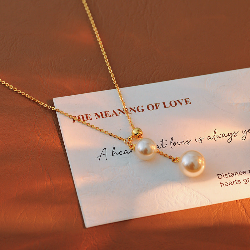 Light Luxury Fashion Design Natural Pearl Collarbone Necklace Strong Light Small Bulb Y-shaped Choker Simple Elegant Women's Ins Trend