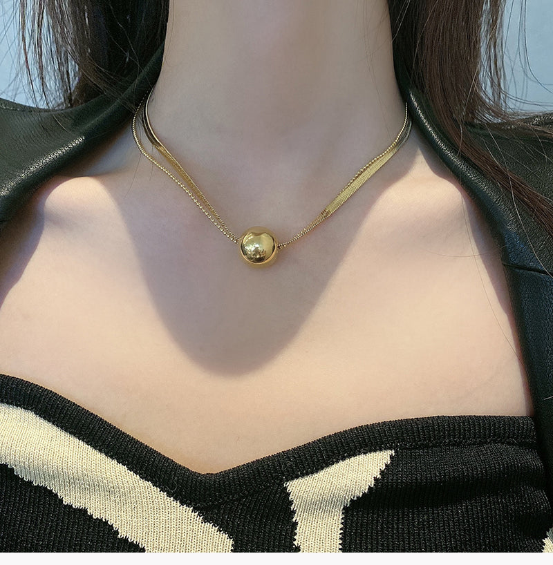 Titanium Steel Gold Round Ball Pendant Snake Bone Necklace for Women Minimalist Style Simple Niche Design Fashion Collarbone Sweater Chain