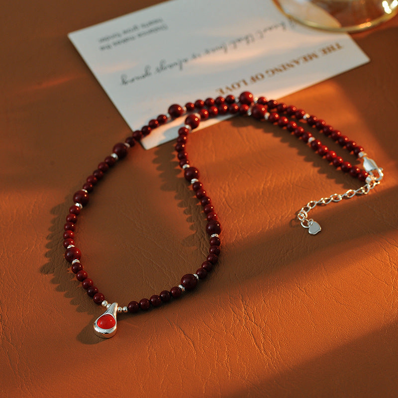 Original Niche Design Autumn Winter Wine Red Shijia Glass Bead Necklace for Women Light Luxury High-end Water Drop Pendant Collarbone Chain