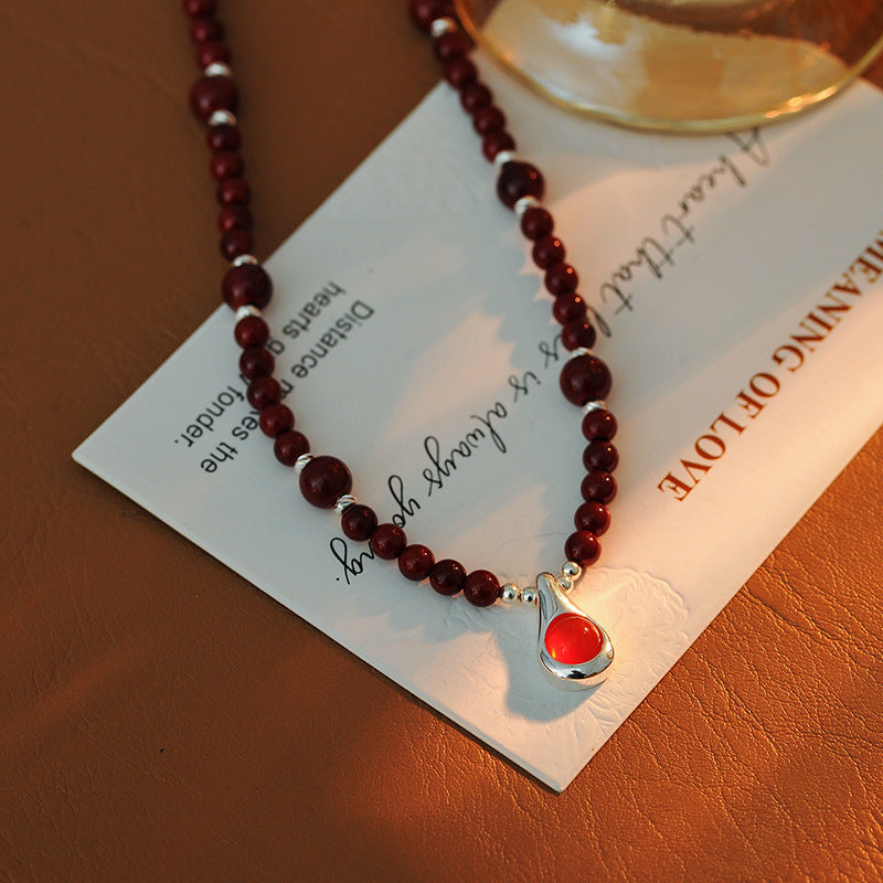 Original Niche Design Autumn Winter Wine Red Shijia Glass Bead Necklace for Women Light Luxury High-end Water Drop Pendant Collarbone Chain